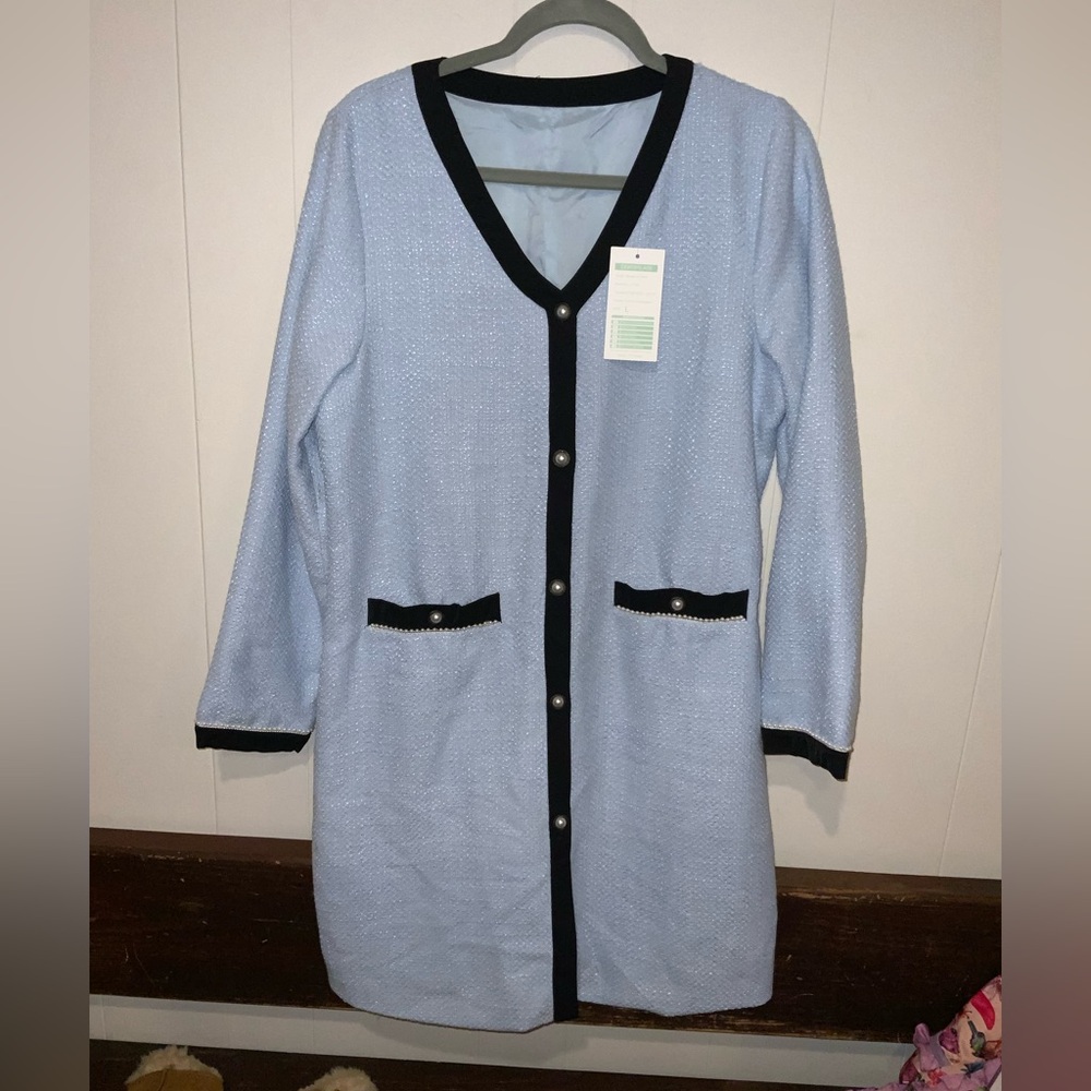 Light blue with black trim, and pearl accents dress